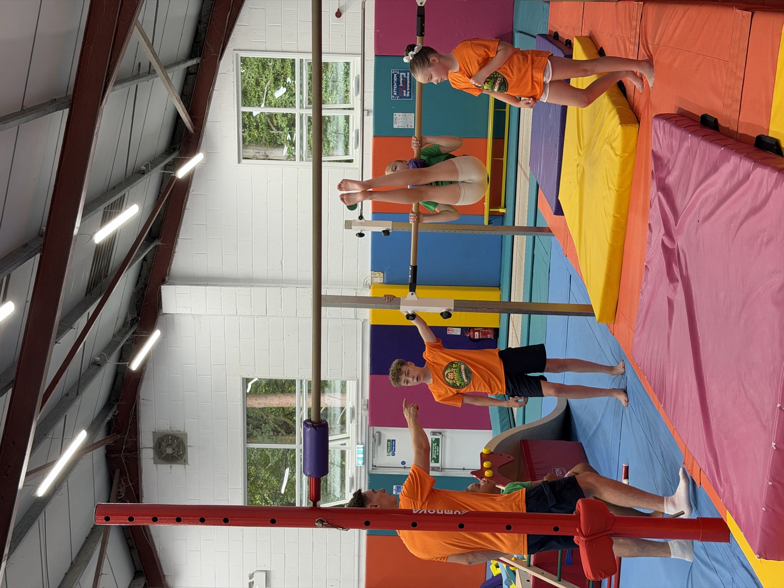 A gymnast swinging on the high bar